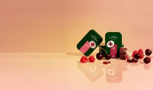 raspberry and cherry gummies with tin concept packaging